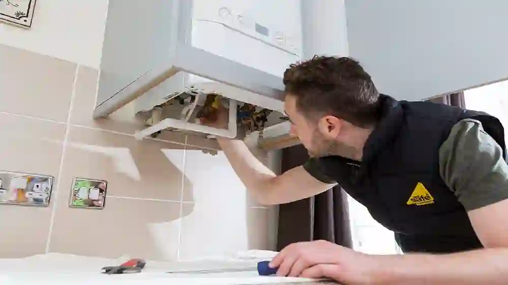 A Gas Safe registered ASL engineer servicing a boiler
